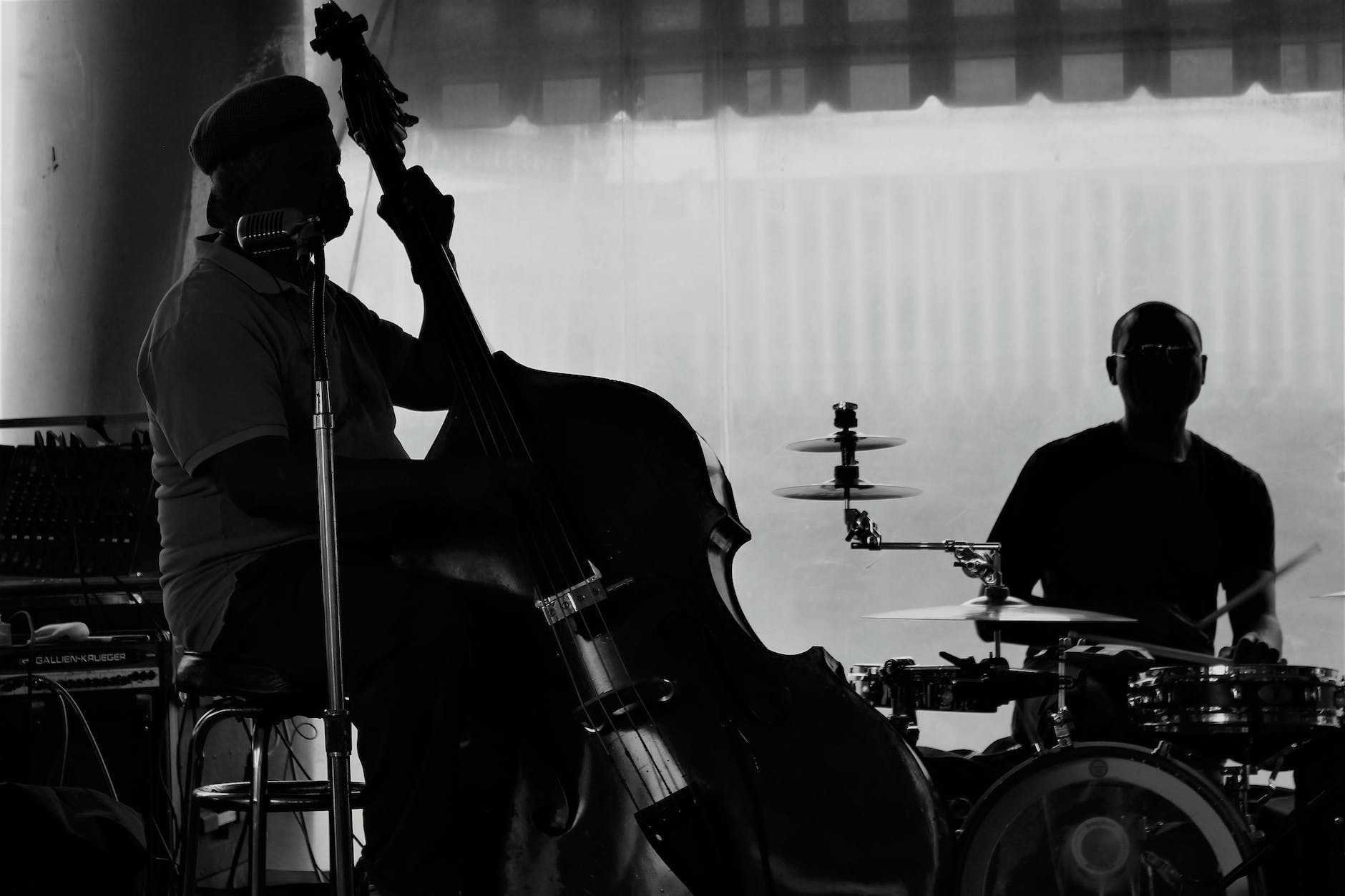grayscale photo of a jazz band playing live music